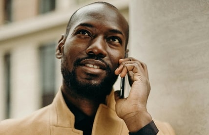 Person on phone paying debts Person on phone paying debts